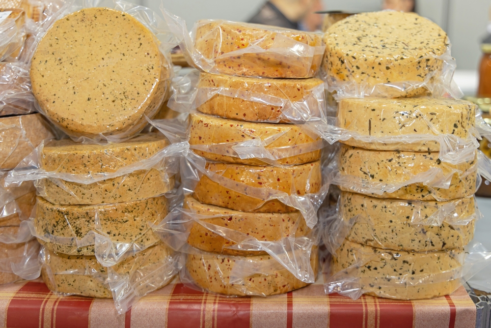 Stacks of cheese that has been vacuum packaged ready for sale.